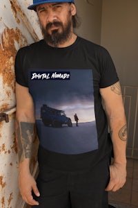 a man wearing a black t - shirt with a picture of a truck on it